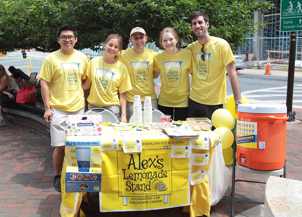 Group of people at a lemonade stand