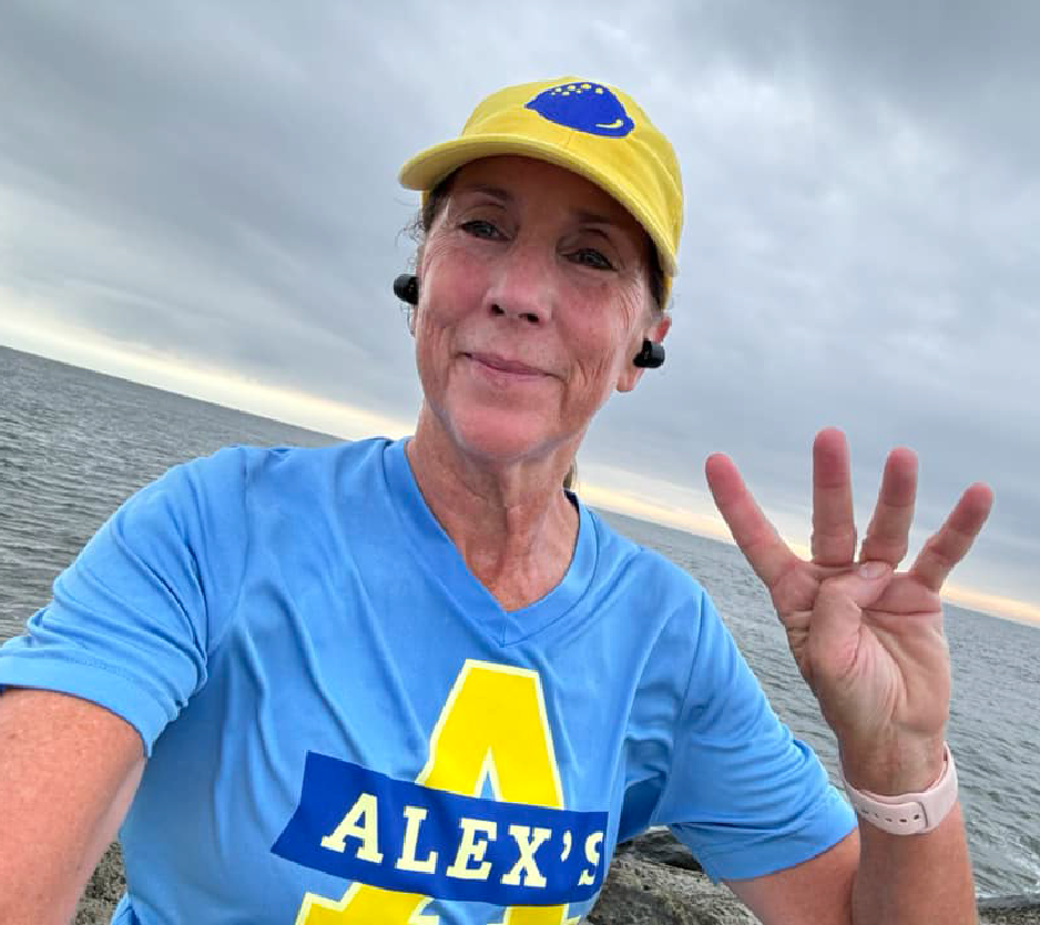 Woman wearing ALSF gear on the beach